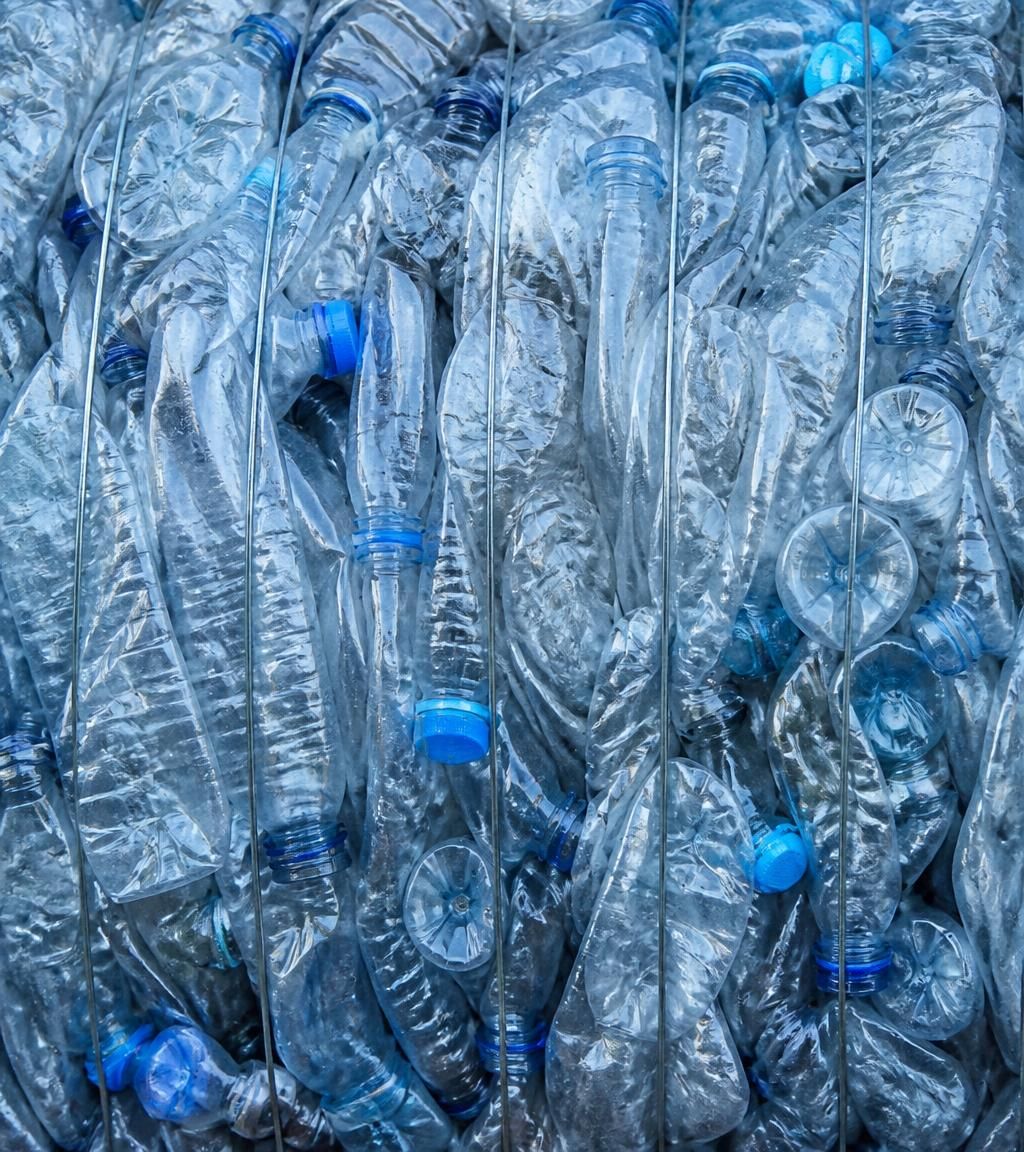 A compressed bale of recovered clear PET bottles ready for its next application.